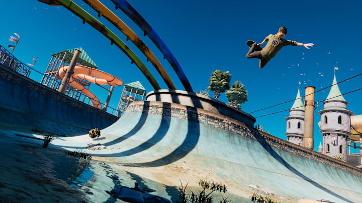 A skater in the air over an empty channel in the Water Park.