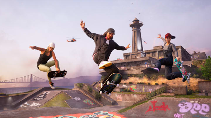 Three skaters getting air in front of a lighthouse.