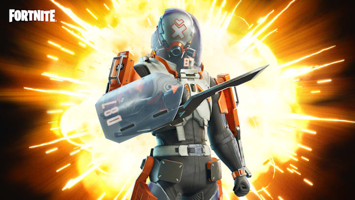 A man in full body armour with a helmet and face-shield covering his head. He has a large blade attached to his arm.