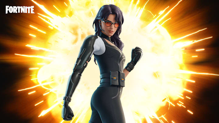A woman in skin-tight black bodysuit with mechanical armor down her arm.