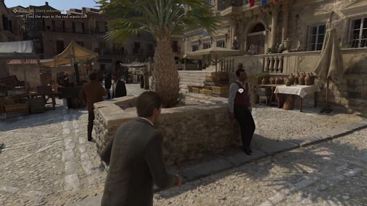 A man in a red waistcoat in Mafia: The Old Country.