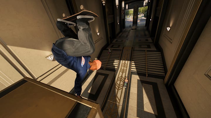 A skater hand-standing at the top of a ramp.
