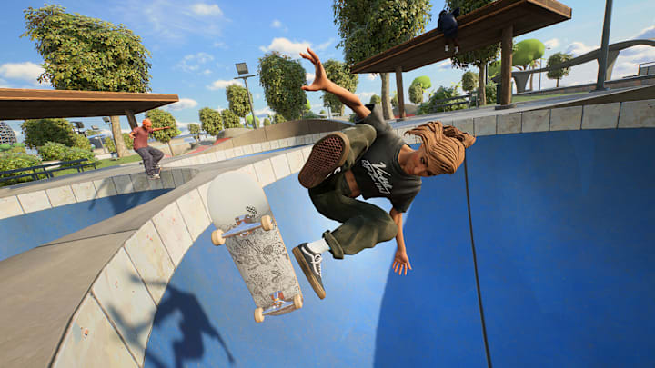 A skater flipping thier board as they go down into a bowl.