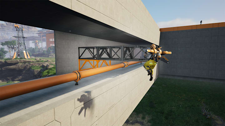 A player flies near a brutalist building using a jetpack in Satisfactory