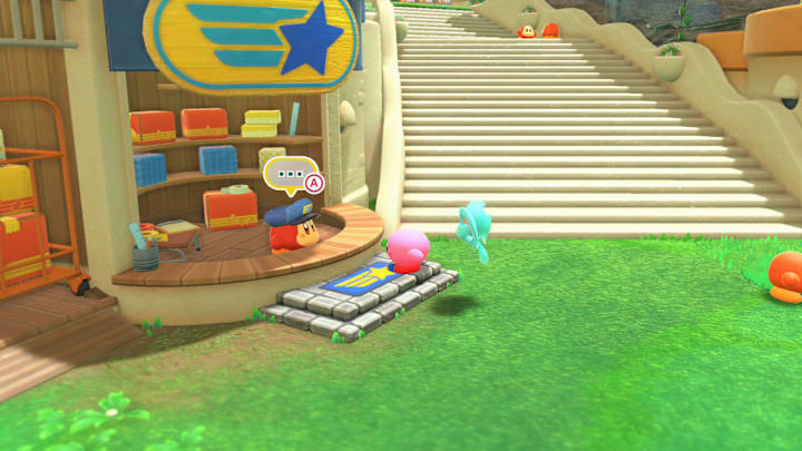 Kirby standing in front of Waddle Dee-liveries in Kirby and the Forgotten Land.