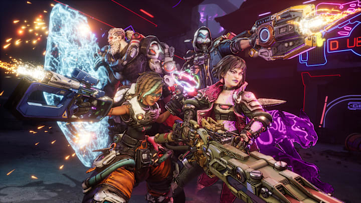 Four people standing formation firing out massive guns.