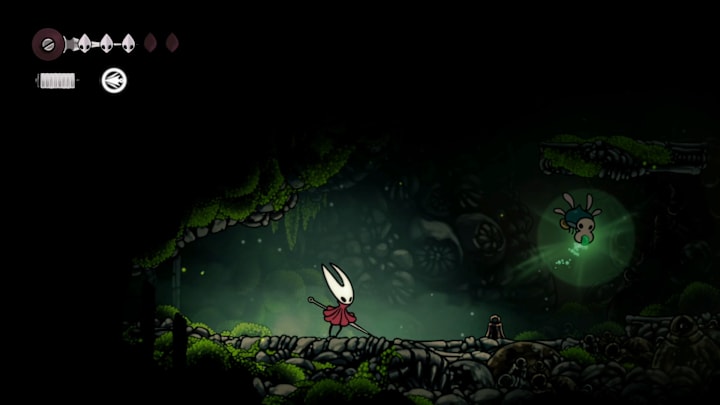 A bug holding glowing Mossberry in a dark cavern in Hollow Knight Silksong. 