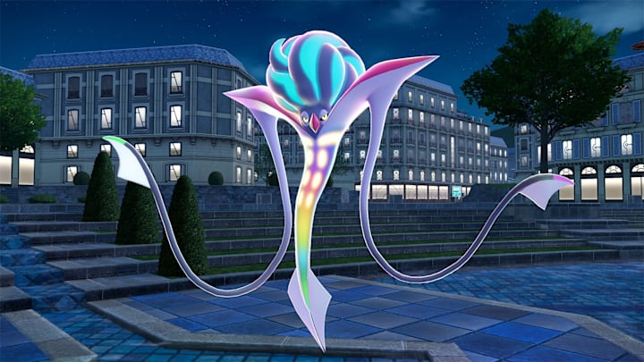 Mega Malamar. A thin Pokemon with a rainbow body and long tentacles for arms.