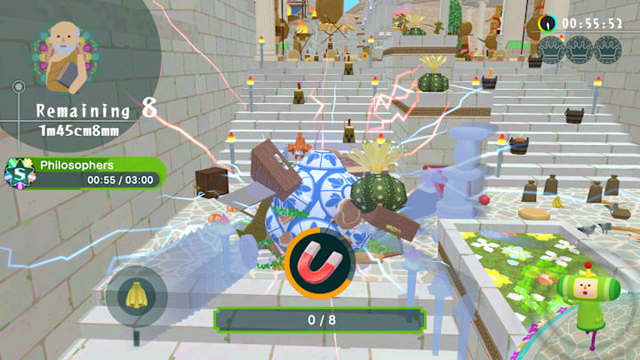 A Katamari being rolled up some stone steps.