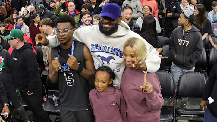 LeBron James, his wife and daughter, pose with son Bryce after he and Sierra Canyon teammates won the California (CIF) State Division 1 boys basketball championship Friday night at the Golden 1 Center in Sacramento.