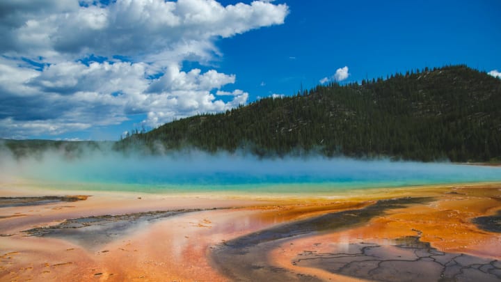 Grand prismatic spring in Yellowstone national park, United States of America. Memory card from vacation, travel background, Wyoming nature landscape, colorful geyser. World famous landmarks.