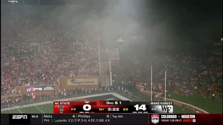 Smoke descends on the stadium due to a fire in a food truck during a matchup between NC State and Wake Forest.