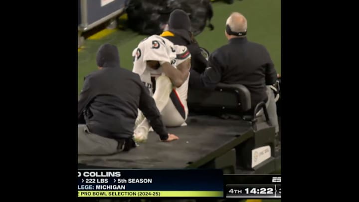 Nico Collins is carted off the field after taking a hard hit to the head.