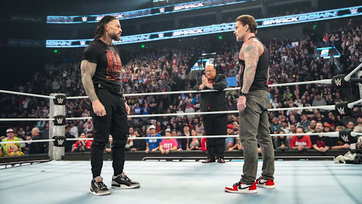 Roman Reigns [L], Paul Heyman [C], CM Punk [R]