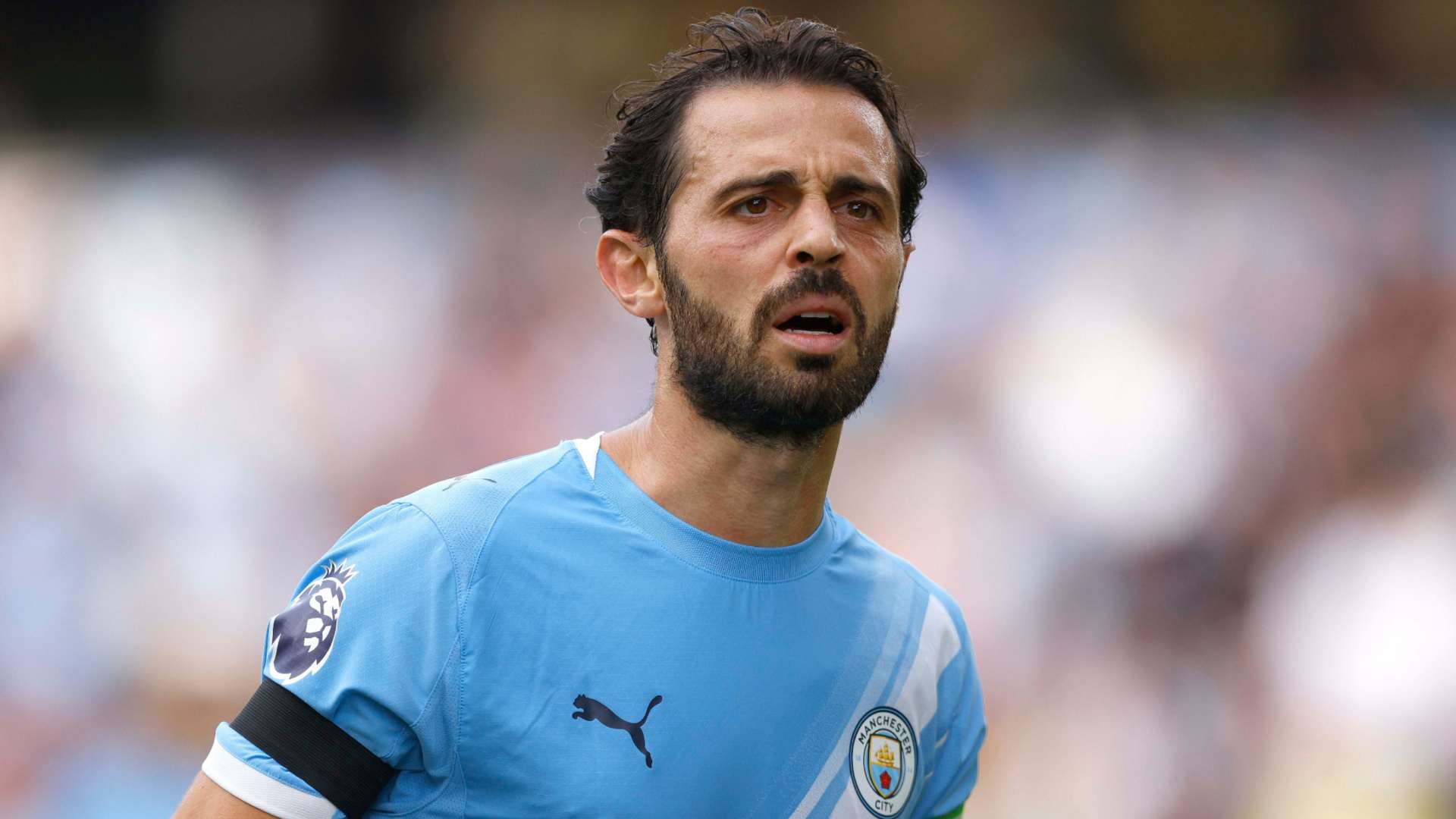 Bernardo Silva squinting.