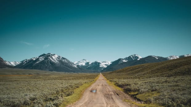 A view of a beautiful mountain from gravel road