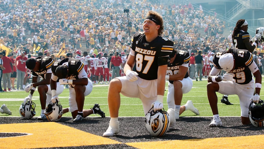 Sept 13, 2025; Columbia, Missouri, USA; Missouri Tigers tight end Brett Norfleet kneels in the end zone prior to Missouri's game against Louisiana at Faurot Field. Sept 13, 2025; Columbia, Missouri, USA; Missouri Tigers tight end Brett Norfleet kneels in the end zone prior to Missouri's game against Louisiana at Faurot Field.