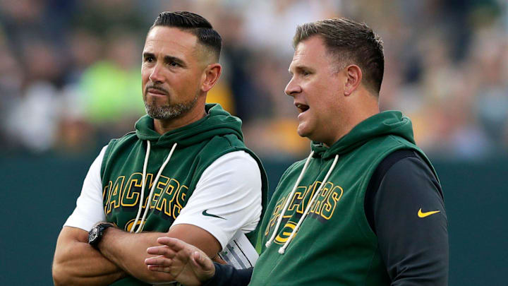 Green Bay Packers Head Coach Matt LaFleur and General Manager Brian Gutekunst talk on the field during Green Bay Packers Family Night on Aug. 2, 2025, at Lambeau Field in Green Bay, Wis.