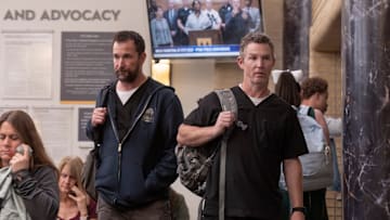 Noah Wyle and Shawn Hatosy in The Pitt. Robby and Abbott head out the pedestrian entrance to find a packed waiting room. (Warrick Page/MAX)
