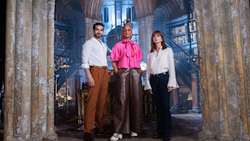 Judges Jozef Youssef, Carla Hall, and Bonnie Wright in Dumbledores Office, as seen on Harry Potter: Wizards of Baking, Season 1.