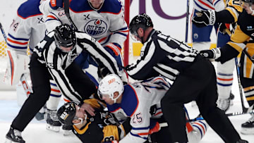 Edmonton Oilers defenseman Darnell Nurse (25) and Pittsburgh Penguins left wing Michael Bunting (8)