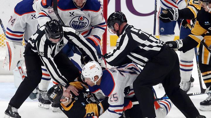 Edmonton Oilers defenseman Darnell Nurse (25) and Pittsburgh Penguins left wing Michael Bunting (8)