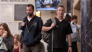 Noah Wyle and Shawn Hatosy in The Pitt. Robby and Abbott head out the pedestrian entrance to find a packed waiting room. 