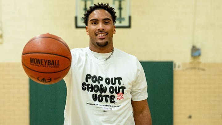 Michigan State football Dillon Tatum participates in a 3-point shootout for NextGen America Michigan State football Dillon Tatum participates in a 3-point shootout for NextGen America