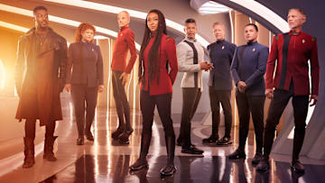 L-R David Ajala as Book, Mary Wiseman as Tilly, Doug Jones as Saru, Sonequa Martin-Green as Burnham, Wilson Cruz as Culber, Blu Del Barrio as Adira and Callum Keith Rennie as Raynor in season 5 of the Paramount+ original series STAR TREK: DISCOVERY. Photo Credit: James Dimmock/Paramount+