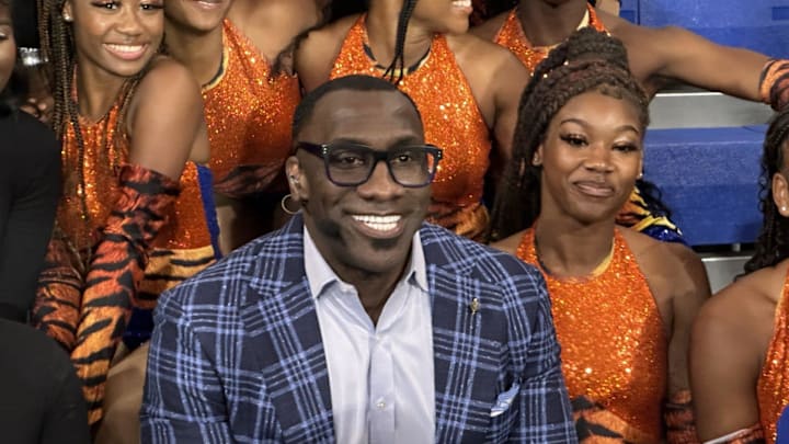 Shannon Sharpe poses with members of the Savannah State Marching Band after a broadcast of ESPN broadcast "First Take"