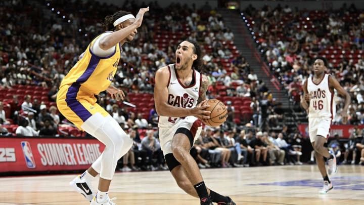 Jaylon Tyson of the Cleveland Cavaliers drives past Moses Brown at the Thomas & Mack Center.