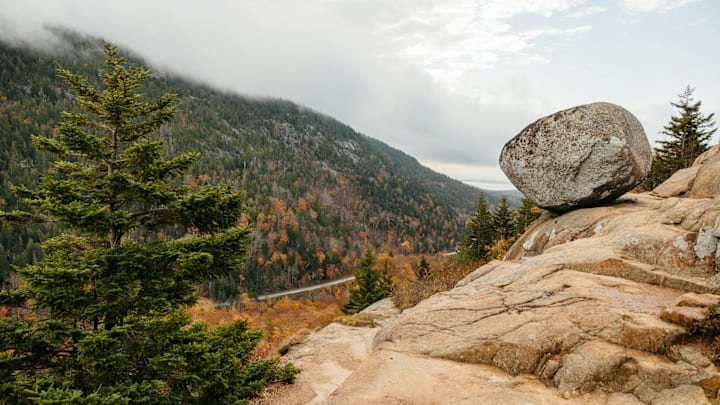 the iconic Bubble Rock, a striking natural feature set against a backdrop of majestic mountains. Bubble Rock, Park Loop Road, Mount Desert, ME, USA