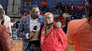 Shannon Sharpe with his Glennville High School football coach William Hall Monday at Savannah State.