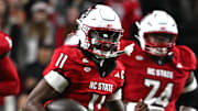 Nov 1, 2025; Raleigh, North Carolina, USA;  North Carolina State Wolfpack quarterback CJ Bailey (11) runs the ball during the first quarter against the Georgia Tech Yellow Jackets at Carter-Finley Stadium. Mandatory Credit: Zachary Taft-Imagn Images