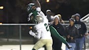 Pacifica's Savion Taylor reaches for the ball but can't make the reception as Long Beach Poly's Juju Johnson defends during the first quarter of a CIF-SS Division 4 quarterfinal game at Pacifica High.