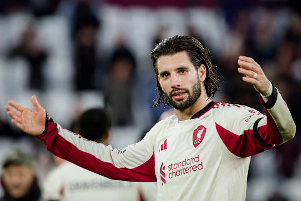 Dominik Szoboszlai celebrating with raised arms. Dominik Szoboszlai celebrating with raised arms.