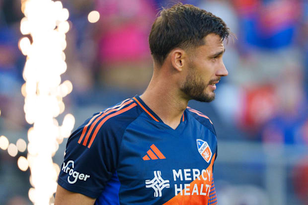 Matt Miazga in front of a pyrotechnic display.