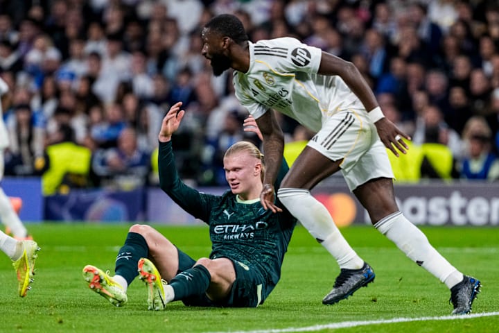 Erling Haaland (left) and Antonio Rüdiger.
