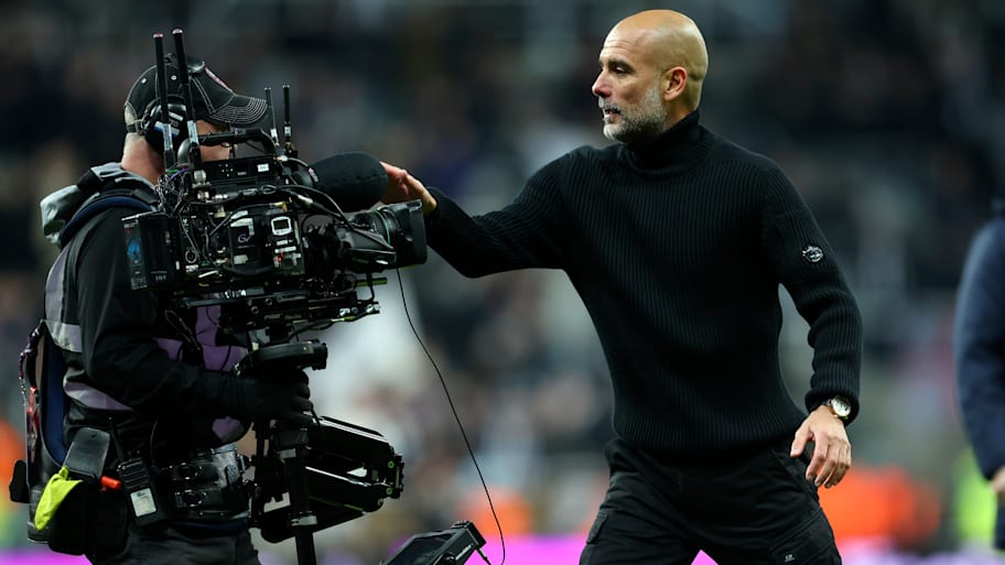 Pep Guardiola (right) getting up close and personal with one camera operator.