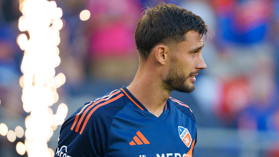 Matt Miazga in front of a pyrotechnic display.