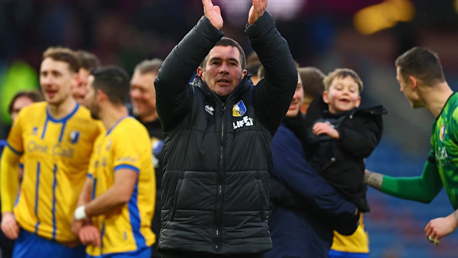 Nigel Clough clapping.