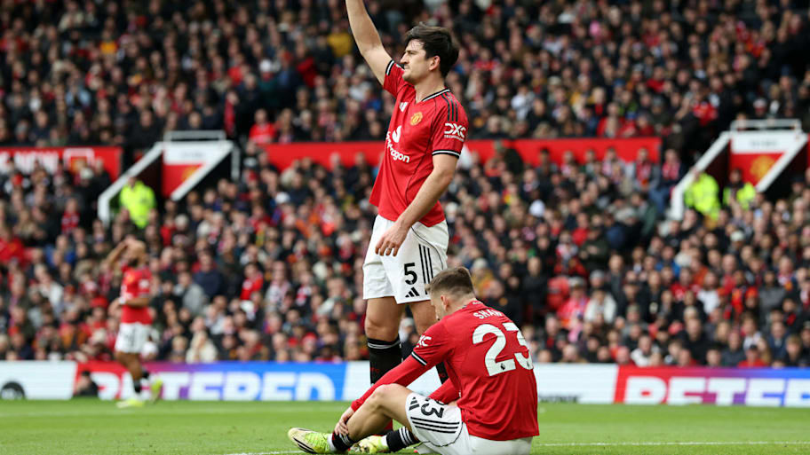 Luke Shaw (bottom) on the turf.