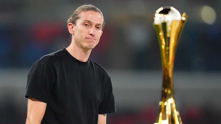 Filipe Luís looking at a rare trophy he didn’t win.