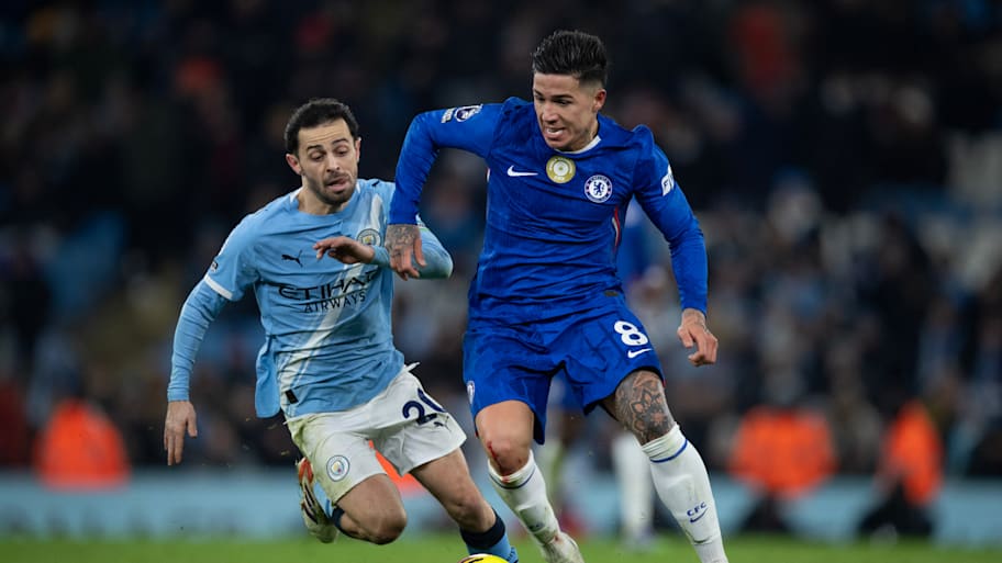 Enzo Fernández (right) fending off Bernardo Silva.