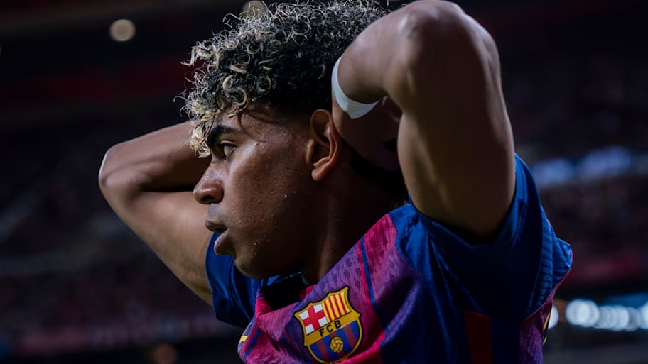 Lamine Yamal with hands on head.