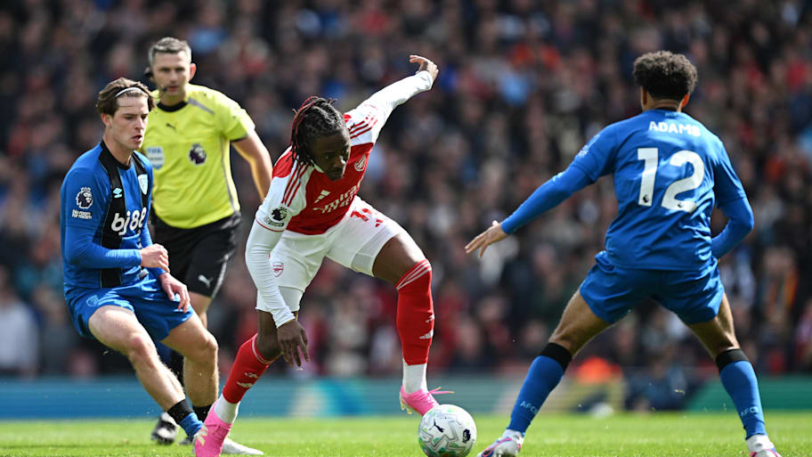 Tyler Adams (right) tackling Eberechi Eze (center).