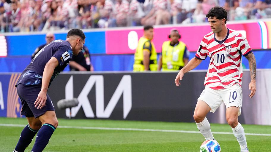 Christian Pulisic taking on his man.