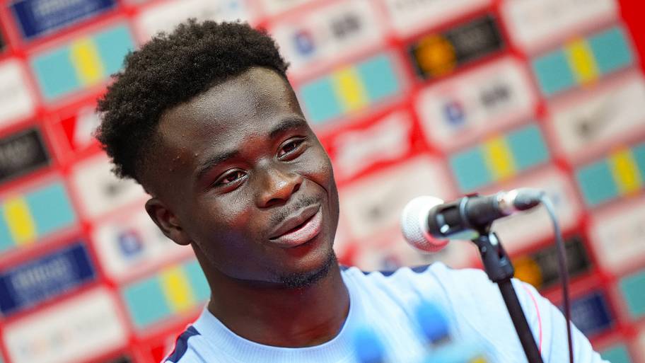 Bukayo Saka speaking into a microphone.