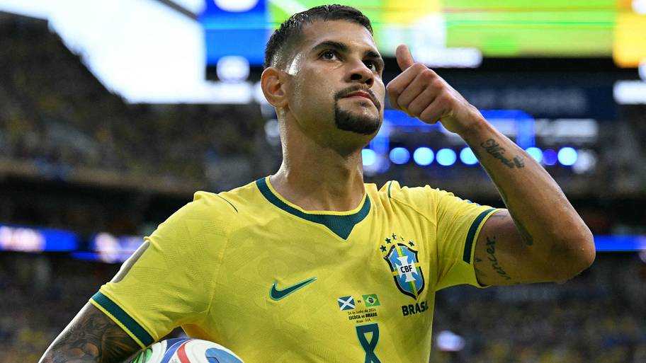 Bruno Guimarães flashing a thumbs up.