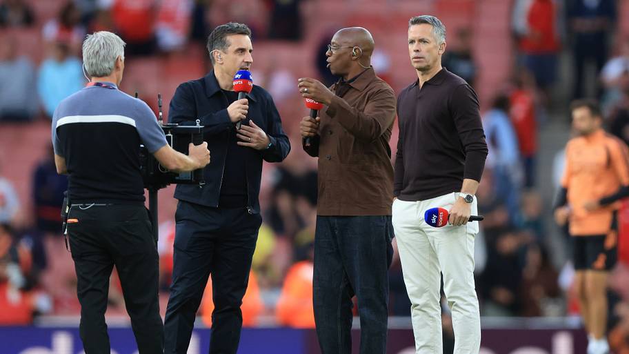 Ian Wright (center) talking.